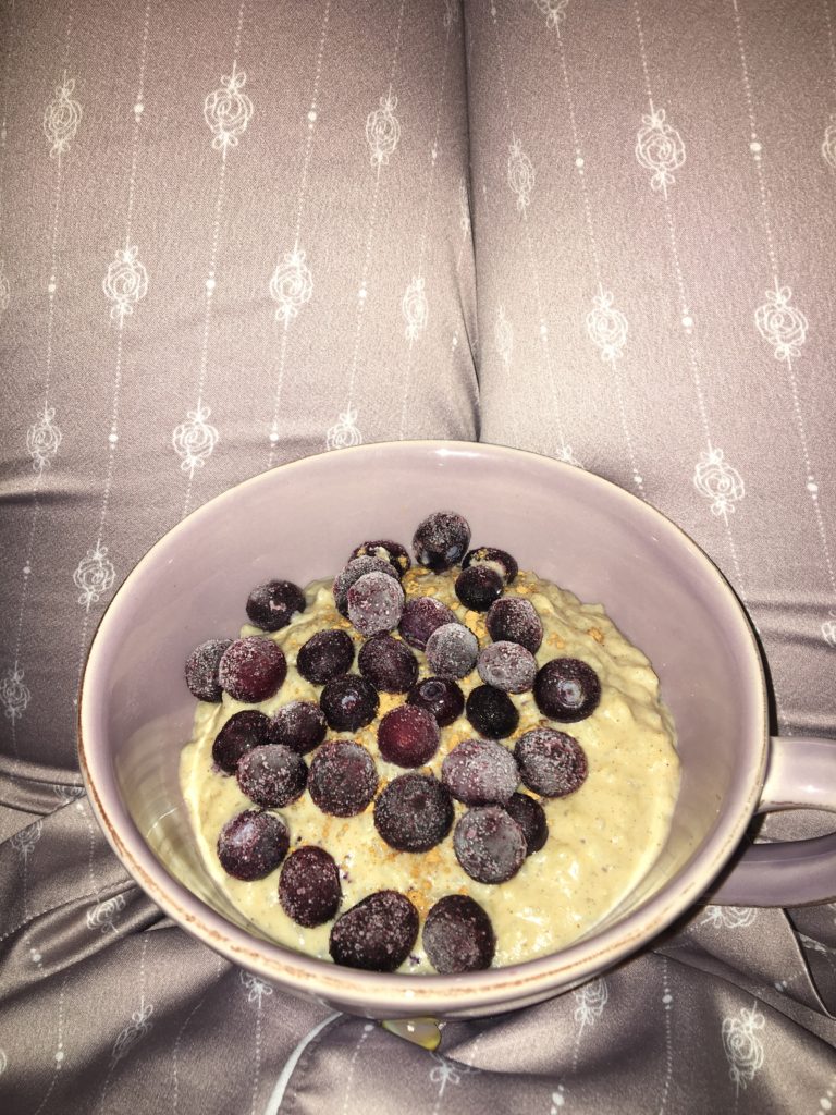 Protein rice pudding made using The Multitasker Vanilla flavour topped with frozen blueberries
